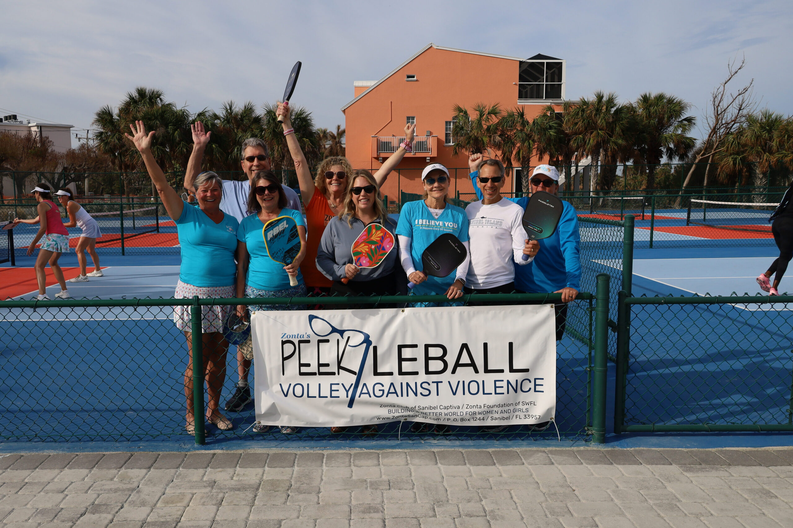 Zonta Members Volley Against Violence Photo with Banner