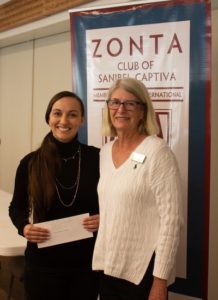 Development Manager for Pace Lee Margo Brewster (L) receiving her 2020 grant award last January from Zontian Jan Alden. 